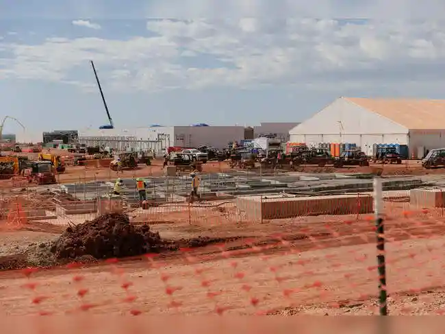 A day after agreeing to a $100 billion investment from chipmaker Nvidia, OpenAI said it had inked deals with two other tech giants to build five new data centres across the United States.<br><br> OpenAI, an artificial intelligence startup, said Tuesday that it would work with Japanese conglomerate SoftBank and cloud computing company Oracle to build computing facilities in Lordstown, Ohio; Milam County, Texas; Shackelford, Texas; Doña Ana County, New Mexico; and a not-yet-named site in the Midwest.<br><br> The new data centres are part of a plan that the three companies unveiled in January with President Donald Trump at the White House. Under the plan, called the Stargate Project, the companies intend to spend $500 billion on new facilities for building AI technologies and delivering them to consumers and businesses. <br><br> With Tuesday's announcement, OpenAI said that it now had agreements in place to build more than $400 billion in data centre infrastructure. It must negotiate additional deals to reach its goal of $500 billion.<br><br> Oracle will pay for and oversee the construction of three of the new data centres. OpenAI will then purchase computing power from Oracle. Oracle's co-chief executive Clay Magouyrk said that the cloud computing giant would pay for the construction of these facilities partly by exploring new kinds of financial deals with various partners, technology providers and other investors.<br><br>