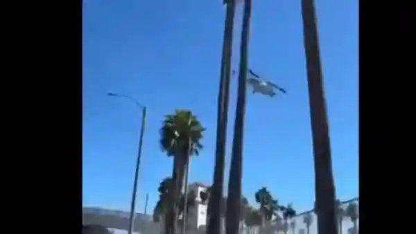 A helicopter reportedly crashed near the intersection of Pacific Coast Highway and Huntington Street on Saturday afternoon, causing multiple injuries. The wreckage ended up lodged in trees at the front of the Hyatt Regency Hotel. Videos captured first responders at the scene, with bystanders watching the aftermath.A helicopter reportedly crashed near the intersection of Pacific Coast Highway and Huntington Street on Saturday afternoon, causing multiple injuries. The wreckage ended up lodged in trees at the front of the Hyatt Regency Hotel.Videos captured first responders at the scene, with bystanders watching the aftermath.Also Read: Dramatic video shows helicopter crash on Sacramento Highway 50 in CaliforniaIn the video, the helicopter is seen flying low, with its blades striking the tops of palm trees. It then begins to spin, causing the person filming to duck. The clip follows the helicopter as it crashes nearby, just a short distance from where the filmer was located.<h4>Watch:</h4>
