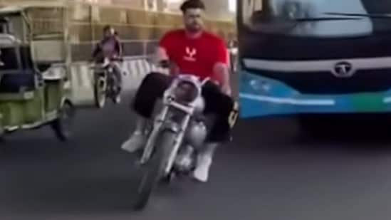A man riding a Royal Enfield Bullet was caught by Delhi Police after an Instagram video showed him performing dangerous stunts in front of a moving city bus. A motorcyclist who performed dangerous stunts in front of a moving Delhi Transport Corporation (DTC) bus has been tracked down and booked after a video of the incident surfaced on Instagram, police said on Wednesday.