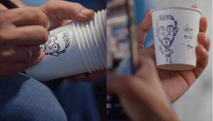 A street-side coffee stall is winning hearts with a unique twist, artist Shyama Prasad Dey draws customers' caricatures on their cups. The viral video of his creative stall has earned him widespread praise online, with many suggesting he deserves a spot at Starbucks.