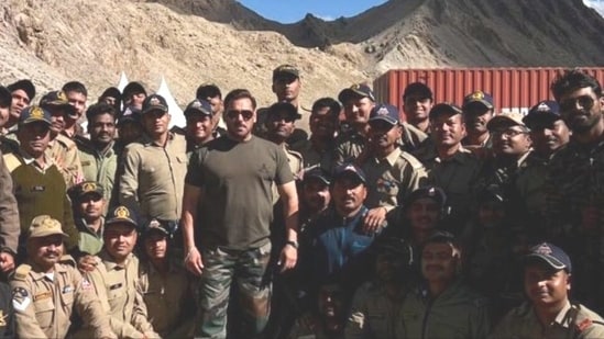 Actor Salman Khan began shooting for his upcoming war drama film, Battle of Galwan, recently. Now, several pictures of the actor at the shoot location in Leh have emerged on social media platforms. In a few photos, Salman was seen posing with several soldiers as they stood together outdoors. In another photo, Salman stood next to the family of a soldier. While the soldier carried a baby in his arms, his wife stood next to him and Salman. The actor smiled as he posed for the camera.