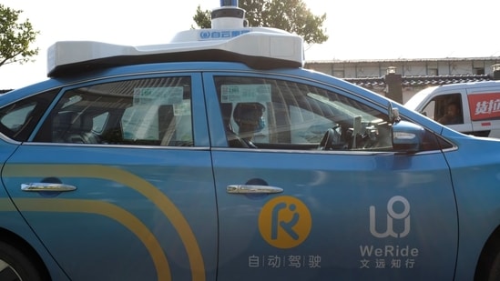 As more robotaxis hit the roads of major cities from the U.S. to China, Chinese companies in Singapore are taking an alternative route by launching robobuses first. In Singapore's resort island of Sentosa, eight-seat minibuses developed by WeRide noiselessly ferry passengers around without drivers.