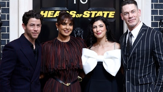 At the Heads Of State premiere in London, Priyanka Chopra showcased a chic Burberry dress while Nick Jonas matched her elegance in navy blue suit. Priyanka Chopra and her husband, Nick Jonas, stepped out in London to attend the Heads Of State premiere. The couple chose stylish ensembles for the date night. While Nick looked dapper in a suit, Priyanka served a fabulous fashion moment in a full fringe dress.