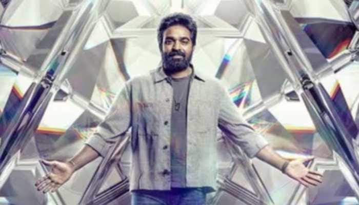 Bigg Boss Tamil Season 9 has been officially announced, with Vijay Sethupathi returning as the host. Chennai: The wait is finally over for Bigg Boss Tamil fans, as the popular reality show is all set to return with its ninth season.<br> <br> This season will once again see Vijay Sethupathi as the host, a familiar face whose charm and presence have become key parts of the show. His return ends weeks of speculation among fans about whether he would continue hosting the much-loved programme.<br> <br> The official announcement was made by the channel on Saturday through Instagram. Along with the news, they released a poster featuring Vijay Sethupathi dressed in a cream denim jacket. The caption read: