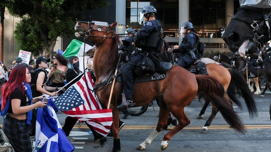 Donald Trump has activated more than 4,000 National Guard members and 700 Marines to quell Los Angeles protests over immigration enforcement. The Los Angeles Police Department has made nearly 400 arrests and detentions since Saturday in connection to immigration protests. The vast majority arrests have been for failing to leave the area in defiance of requests from law enforcement, according to police. There have been a handful of more serious charges including for assault against police officers and for possession of a Molotov cocktail and a gun.