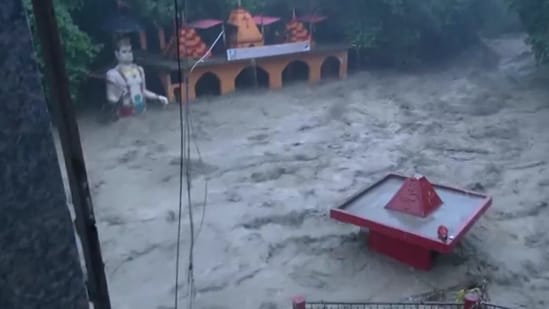Heavy rainfall triggered a cloudburst in Uttarakhand's Dehradun on Tuesday morning, following which, Tamsa river swelled up. The India Meteorological Department issued a red alert warning for Dehradun and Tehri Garhwal till 9 am. Scary visuals from Dehradun show Tamsa river in spate and Tapkeshwar Mahadev temple inundated after heavy rainfall.