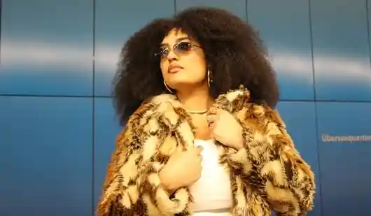 How to wear a faux fur coat without looking overdone or freezing in the cold