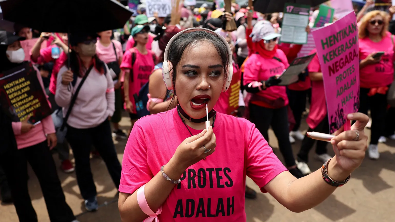 Hundreds of women wearing pink and wielding broomsticks marched to parliament in Indonesia's capital on Wednesday to protest against police abuses and wasteful government spending. Protests in Jakarta and other key cities have stretched into their second week, fuelled by anger over cost of living issues and lavish perks for MPs.