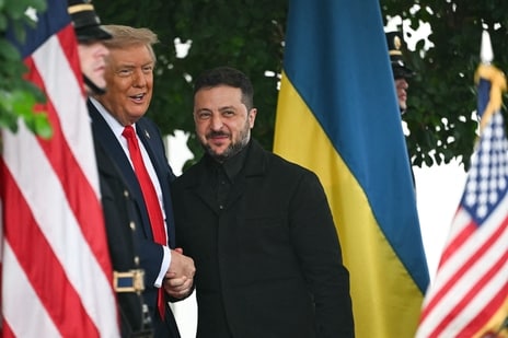 “I CAN'T BELIEVE it,” said Donald Trump, America's president, as he greeted Volodymyr Zelensky, his Ukrainian counterpart, outside the White House on August 18th. “I love it.” Mr Trump was referring to Mr Zelensky's decision to bow to American pressure and wear a suit-like garment to the meeting, an issue that had contributed to an acrimonious blow-up in the Oval Office in February (when Mr Zelensky wore a black sweater). It was a promising start to a pivotal summit, with a clutch of European leaders in attendance to support the Ukrainian leader.