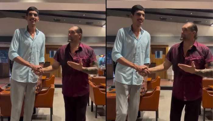 In a jaw-dropping moment that left fans stunned, a 17-year-old Karan Singh from Meerut, towering at 8 feet 2 inches, made WWE legend The Great Khali look small. Their viral meeting at a wrestling training centre has fans calling Singh the “Greater Khali,” with Khali eager to train him for WWE stardom.