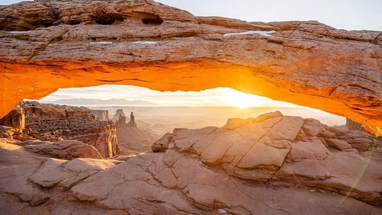 In May and September, the two most popular months to visit Arches National Park, a last-minute trip is nearly impossible. The only way into the park is by reserving a spot in advance. But during most of July and August, when heat makes crowds thin, the National Park Service pauses timed-entry slots. In the Utah town of Moab, gateway to both Arches and Canyonlands national parks, you can find hotel rooms and guided tours easily. The triple-digit temperatures? A minor detail.