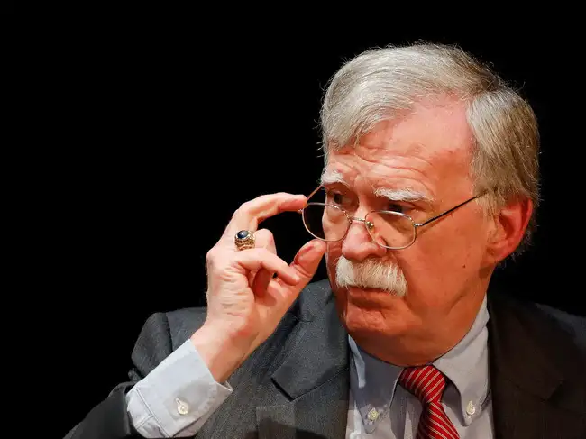 John Bolton shared his views on Donald Trump's hot mic talk with Emmanuel Macron. It involved Vladimir Putin's wish for a deal. Bolton thinks Putin wants to help Trump get a Nobel Peace Prize. Meanwhile, FBI agents searched John Bolton's house in Maryland. The search was part of a national security investigation. Officials have not yet revealed the details.