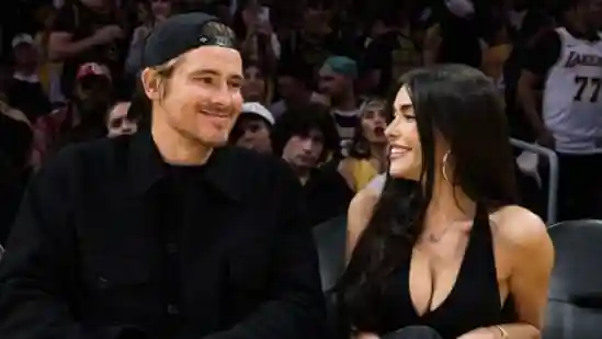 Justin Herbert's quick reaction saves Madison Beer from a flying basketball