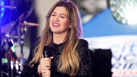 Kelly Clarkson is back in the spotlight as she is returning to reality show The Voice this week. She will be reuniting with fellow coaches Adam Levine and John Legend as the NBC music competition show tapes footage for its upcoming Season 29, which has been titled Battle Of Champions.