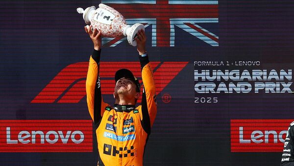 Lando Norris delivered a commanding performance to win the 2025 Hungarian Grand Prix on Sunday (August 3) at the Hungaroring. Notably, Norris secured his ninth career win in a race filled with strategic battles and high-stakes drama. Oscar Piastri finished second, making another McLaren one-two this season, with George Russell taking the final podium place in third.