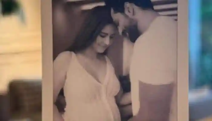 On Tuesday, The couple shared a Polaroid in which Katrina and Vicky lovingly cradle the actress' growing baby bump. Mumbai: Bollywood stars Ananya Panday, Janhvi Kapoor, Sonam Kapoor, Parineeti Chopra, and others showered love and good wishes on soon-to-be parents Katrina Kaif and Vicky Kaushal. Soon after the couple announced their pregnancy, celebrities flooded the comments section with congratulatory messages.