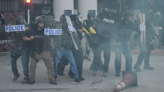 Police were deployed in riot gear in Los Angeles to control crowds as hundreds of protestors camped outside a federal detention centre The United States Immigration and Customs Enforcement officers on Friday conducted a series of raids across Los Angeles, leading to protests erupting across the city and police enforcing riot-control measures against the demonstrators.