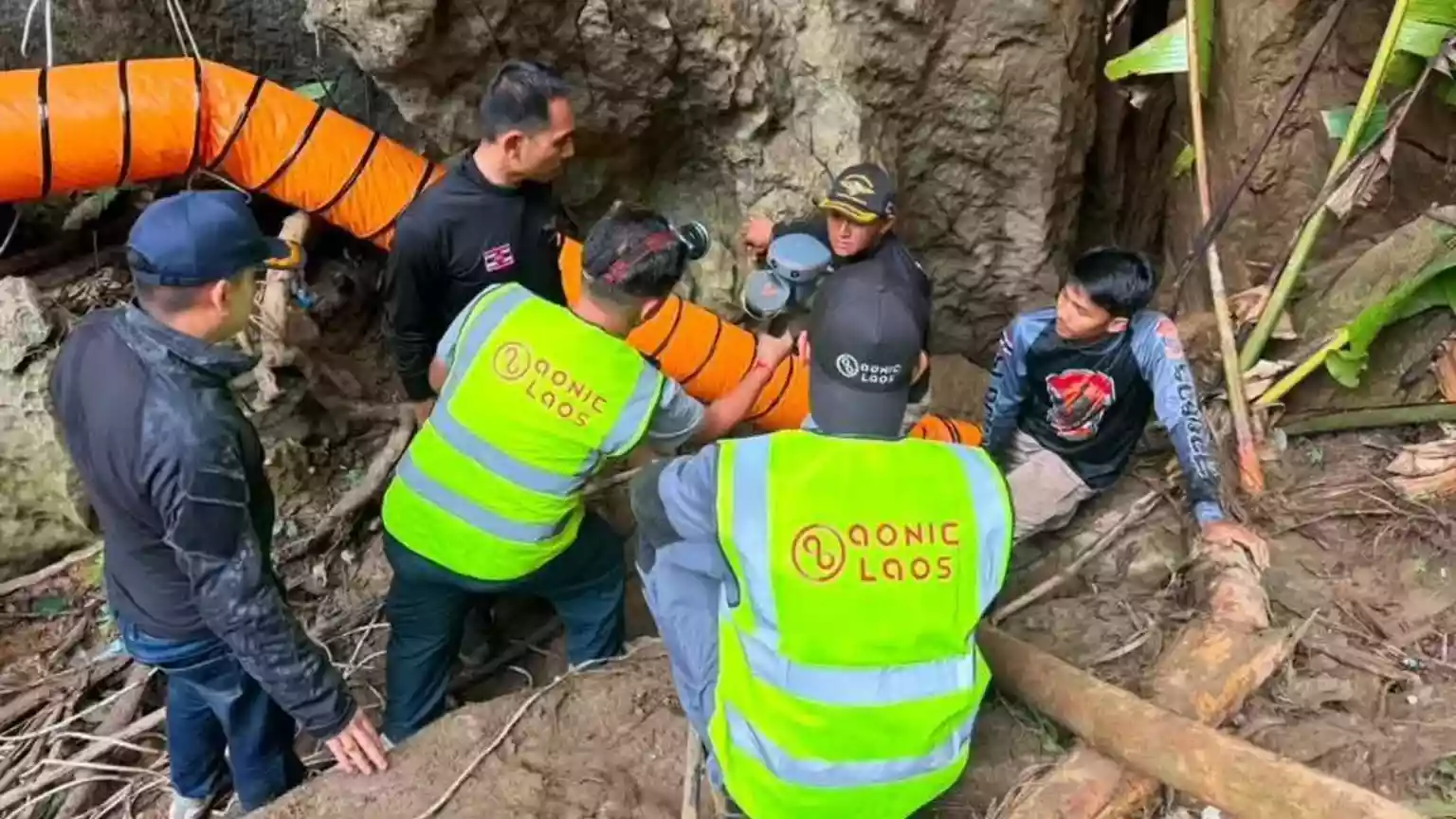 Rescuers race to free seven people trapped in flooded Laos cave