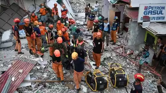 Rescuers used backhoes and sniffer dogs to look for survivors in collapsed houses and other damaged buildings in the central Philippines on Wednesday, a day after an earthquake killed at least 69 people. The death toll was expected to rise from the magnitude-6.9 earthquake that hit at about 10 pm Tuesday and trapped an unspecified number of residents in the hard-hit city of Bogo and outlying rural towns in Cebu province.