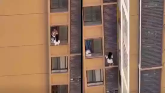 Shocking video shows woman clinging to 10th-floor wall to avoid lover’s wife