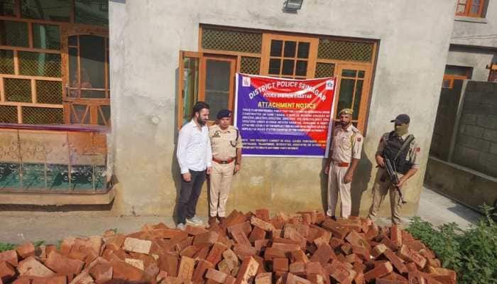 Srinagar Police on Monday said that in another significant move to combat the drug menace and dismantle the infrastructure supporting narcotics trafficking, a residential property worth approximately Rs 1.5 crore was attached under the Narcotic Drugs and Psychotropic Substances (NDPS) Act.