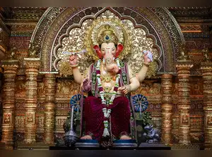The Lalbaugcha Raja idol's immersion faced significant delays due to high tide and technical issues at Girgaon Chowpatty. After arriving over 28 hours after the procession began, several failed attempts to move the idol onto a raft occurred. Finally, the idol was successfully transferred at 4:45 pm, with the final immersion expected around 11 pm after the next high tide.