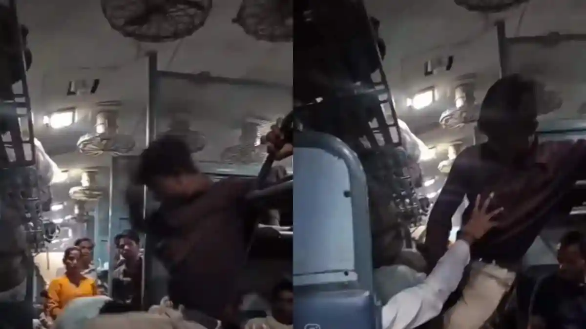 Train journeys in India are often crowded, but recent incidents of ticketless travellers taking seats meant for others have shocked many. One recent video is getting attention for showing two passengers struggling for an upper berth. It's unclear if either of them actually had a reserved seat, but their fight looked almost like a wrestling match.Train journeys in India are often crowded, but recent incidents of ticketless travellers taking seats meant for others have shocked many. One recent video is getting attention for showing two passengers struggling for an upper berth. It's unclear if either of them actually had a reserved seat, but their fight looked almost like a wrestling match.The passenger already on the top berth was seen mimicking moves from WWE, just like Rey Mysterio, as he almost attempted a chokeslam on the other passenger.<strong>WWE Style Fight Captured Inside Indian Railways</strong>The clip starts with a man on the floor grabbing the legs of the passenger on the upper berth, trying to pull him down. After several failed attempts, he even bites the legs. In response, the person on the upper berth grabs his head and neck, almost choking, slamming him while holding the handle for balance. He then puts the man down and starts punching him. The fight gets so intense that other passengers are forced to step in and separate the two.