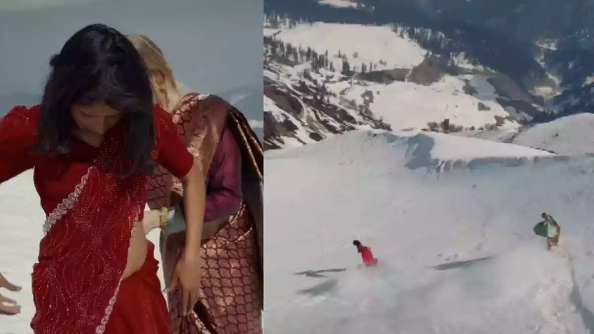Two Women Snowboard Down Gulmarg’ s Snow-Covered Slopes In Sarees