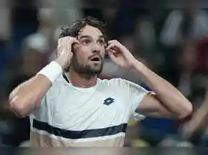 Valentin Vacherot, ranked 204th, secured the biggest win of his career by defeating a hobbled Novak Djokovic 6-3, 6-4 to reach the Shanghai Masters final. The 26-year-old, who was an alternate in qualifying, expressed disbelief at his victory. He could face his cousin, Arthur Rinderknech, in the championship match.Valentin Vacherot, ranked 204th, secured the biggest win of his career by defeating a hobbled Novak Djokovic 6-3, 6-4 to reach the Shanghai Masters final. The 26-year-old, who was an alternate in qualifying, expressed disbelief at his victory. He could face his cousin, Arthur Rinderknech, in the championship match.Valentin Vacherot earned the biggest win of his career by beating a hobbled Novak Djokovic 6-3, 6-4 on Saturday to reach the Shanghai Masters final - where he could face his cousin.<br><br> The 204th-ranked Vacherot, of Monaco, was an alternate in qualifying but is having a career week.<br><br>