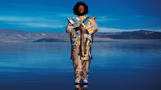 When Kamasi Washington takes the stage, his towering 6' 3” frame and flowing locks create an almost mythical presence, commanding attention before he even lifts his tenor saxophone to his lips. The Los Angeles-born virtuoso has emerged as the defining voice of modern jazz's renaissance, weaving together spiritual and expansive compositions that blur the lines between jazz, hip-hop, classical music, and R&B, with an intensity that feels both ancient and futuristic. As co-founder of the West Coast Get Down collective, alongside artists such as Thundercat and Cameron Graves, Washington, 44, represents a generation that has breathed new life into jazz, making it urgent and essential again.
