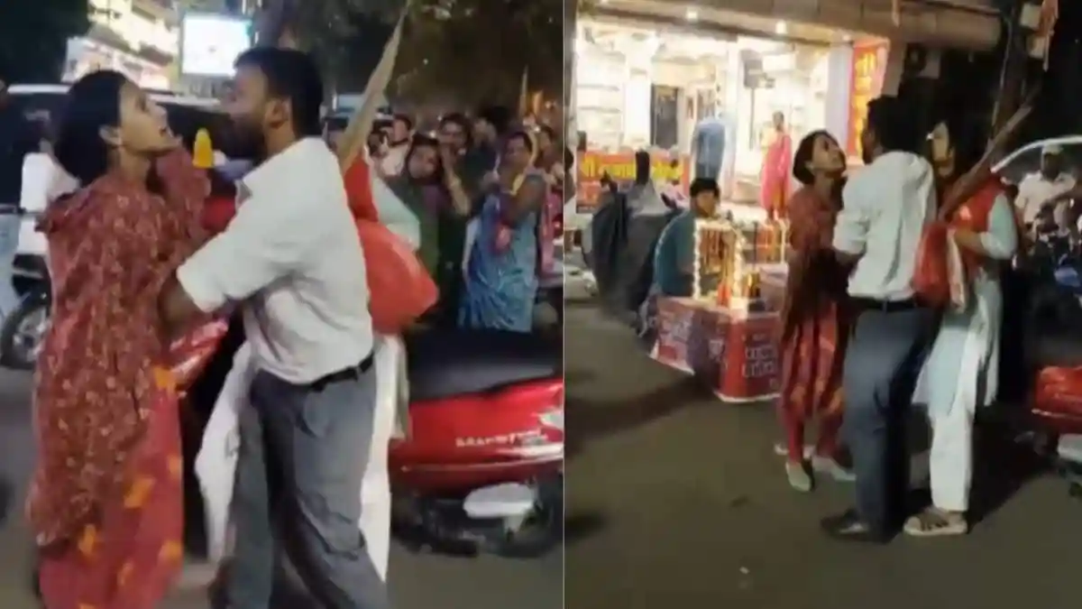 While many married women and couples celebrated Karwa Chauth with love and enthusiasm, a dramatic scene unfolded in Indore's Nanda Nagar area. On the eve of Karwa Chauth, a woman reportedly caught her husband shopping with his alleged girlfriend. What began as a quiet night of festive preparations quickly turned chaotic as the furious wife confronted the pair in the middle of a busy street.While many married women and couples celebrated Karwa Chauth with love and enthusiasm, a dramatic scene unfolded in Indore's Nanda Nagar area. On the eve of Karwa Chauth, a woman reportedly caught her husband shopping with his alleged girlfriend. What began as a quiet night of festive preparations quickly turned chaotic as the furious wife confronted the pair in the middle of a busy street.The heated altercation drew a crowd, with bystanders recording the incident on their phones. The widely shared video shows the wife holding onto both her husband and the other woman and shouting at them in anger. Despite the husband's attempts to break free, she refuses to let go.