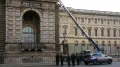 A 38-year-old woman, who was arrested this week along with four other people in connection with the daring $102 million jewel heist at the Louvre Museum's