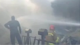 At least four people were killed after an Iranian army helicopter crashed into a fruit and vegetable market in central Iran on Tuesday