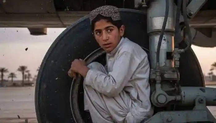 A 13-year-old Afghan boy was discovered hidden in a plane's landing gear after a flight to Delhi, miraculously surviving the perilous journey. Read what happened next in this shocking security breach. A serious security lapse was witnessed at Delhi's Indira Gandhi International Airport on Sunday when a 13-year-old Afghan boy was discovered hidden in the landing gear of a Kam Air plane. The boy, from Kunduz, had apparently taken the entire ride from Kabul to Delhi without a ticket.