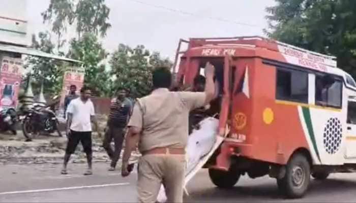 A horrifying video from Gonda, UP, showed a body thrown from a moving ambulance onto a highway amidst protests. A ghastly and extremely disturbing incident has surfaced in the Gonda district of Uttar Pradesh, where a video allegedly capturing a body being hurled from an ambushing vehicle onto the highway went viral, triggering widespread anger. The event unfolded amidst protests by agitated family members and villagers after the death of a 24-year-old man, Hriday Lal.
