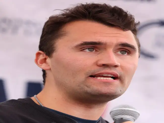 A memorial service for conservative activist Charlie Kirk drew thousands, including prominent figures like Donald Trump and Tucker Carlson, yet his parents were notably absent. Kirk, who founded Turning Point USA, came from a background of entrepreneurial and supportive parents, with his father being an architect and his mother a mental-health counselor.