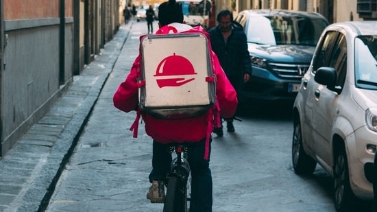 A university student working as a food delivery driver in China has been hailed a hero after spotting a blood-stained pillow with an emergency number scrawled on it, leading to the rescue of a woman trapped in her bedroom for 30 hours without food or water.