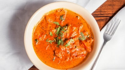 A woman shared her very first experience of trying Indian food, and it did not go as smoothly as she probably expected. She posted about the meal on X, showing pictures of what she ordered: butter chicken, garlic naan, keema samosa and mango lassi. Although she liked the taste, many social media users weren't impressed by her choices. Instead of encouraging her, they pointed out that she had gone for the most basic and common Indian dishes, the ones almost everyone orders when trying Indian food abroad for the first time.