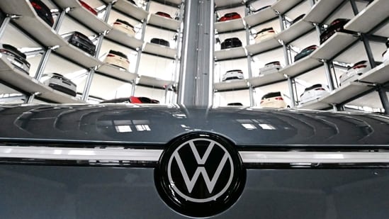About 20,000 employees will voluntary depart by 2030 as the firm restructures its German operations, targeting around 35,000 job cuts without mandatory layoffs. Volkswagen AG said about 20,000 employees will voluntarily leave the company by the end of the decade as the carmaker restructures its German operations to cope with uneven demand for its vehicles.