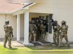 Amidst a surge in hiring, ICE is bolstering its deportation efforts, training new recruits in Brunswick, Georgia. The agency is preparing for potential conflicts, equipping agents with protective gear and specialized units. Training emphasizes legal boundaries, including warrant procedures and limitations on entering private residences and vehicles, reflecting the agency's evolving tactics and legal considerations.