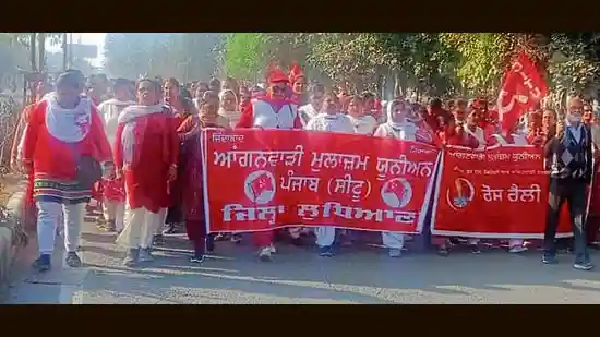 Anganwadi workers and helpers staged a massive protest near Gill Road on Monday, over extremely low wages and stagnant Integrated Child Development Services