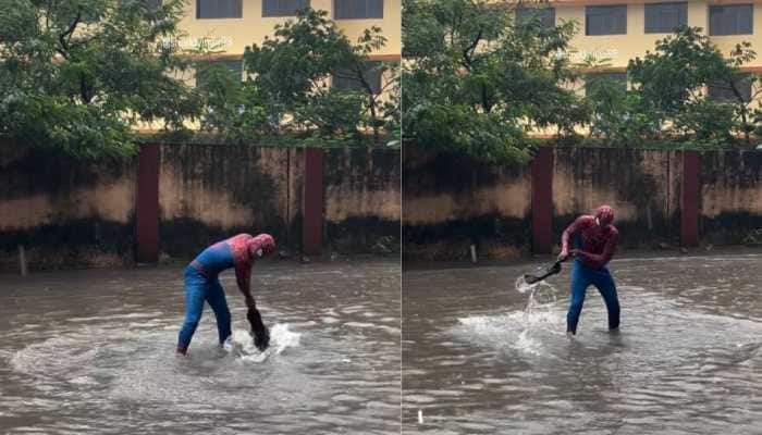 Armed with nothing but a wiper, a man dressed as “Spider-Man” became an unlikely hero for Mumbaikars struggling in the city's heavy rains and flooding.<br> Armed with nothing more than a wiper, a man dressed as “Spider-Man” became an unlikely hero for Mumbaikars struggling in the city's heavy rains and flooding.