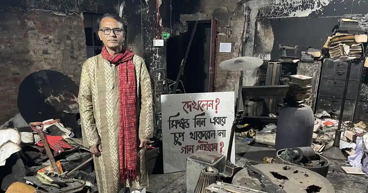 I walked in on Jamshed Nawar Tapan methodically picking up charred books from the floor and placing them into a steel almirah. The office he was standing in