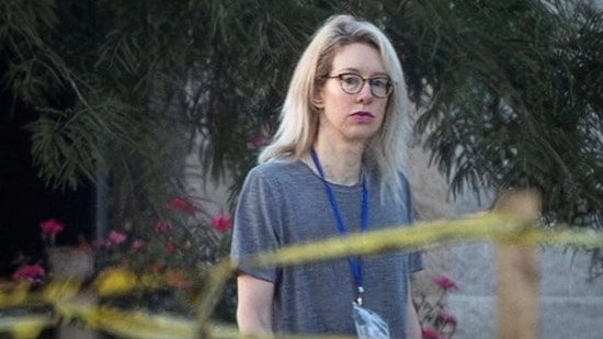 Biotechnology entrepreneur Elizabeth Holmes now leads a starkly different life. On Saturday, August 2, the former Theranos CEO was seen exercising in the outdoor yard of Federal Prison Camp Bryan in Texas. This is the same prison where Ghislaine Maxwell, convicted child sex trafficker and accomplice of Jeffrey Epstein, has recently been shifted. According to People magazine, the 41-year-old held free weights as she paced the grounds, appearing focused and solitary.