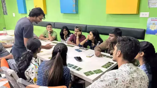 The faint sounds of cards falling, dice rolling, and the occasional chuckle snowballing into laughter set the tone at Eve's Coffee at Anayara in