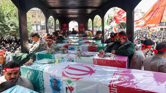 Both Israel and Iran claimed victory in the war that ended with a ceasefire, with Iranian leader Khamenei downplaying the US strikes.  Iran will hold a state funeral service Saturday for around 60 people, including its military commanders, killed in its war with Israel, after Tehran's top diplomat condemned Donald Trump's comments on supreme leader Ali Khamenei as 