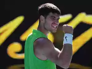 Carlos Alcaraz dominated Corentin Moutet in straight sets to reach the Australian Open last 16, marking his 100th Grand Slam match with a commanding