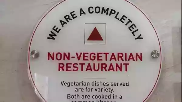 Food outlets offering 'only vegetarian' food are a common sight in India, but a restaurant signboard in Kerala has drawn attention for its unusual warning