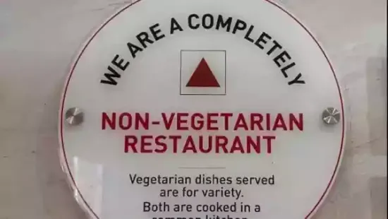 Food outlets offering 'only vegetarian' food are a common sight in India, but a restaurant signboard in Kerala has drawn attention for its unusual warning