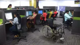 Visually challenged Nikhil Dattatraya Ghatge navigates the floors of Accenture's Koramangala office in Bengaluru confidently using his white cane